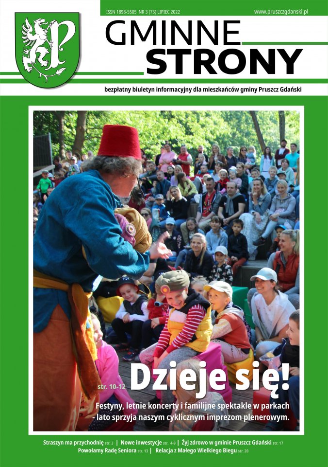 Strona tytułowa gazety Gminne strony - Główne zdjęcie - Teatr w plenerze, na pierwszym planie aktor, w tle widownia pełna dzieci