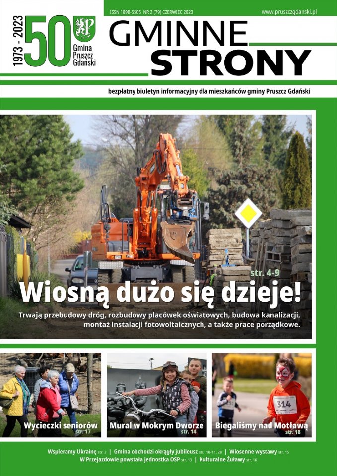 Strona tytułowa gazety Gminne strony - Główne zdjęcie - koparka w trakcie prac budowlanych na drodze.